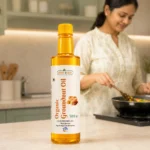 Root2Leaf Organic Groundnut Oil product pack in a lifestyle studio setting