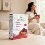 Root2Leaf Organic Hibiscus Powder product pack in a lifestyle studio setting
