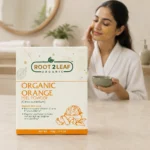 Root2Leaf Organic Orange Peel Powder product pack in a lifestyle studio setting
