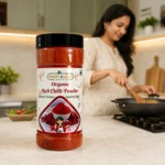 Root2Leaf Organic Red Chilli Powder product pack in a lifestyle studio setting