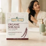 Root2Leaf Organic Shikakai Pods Powder product pack in a lifestyle studio setting