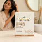 Root2Leaf Organic Soapnut Powder product pack in a lifestyle studio setting